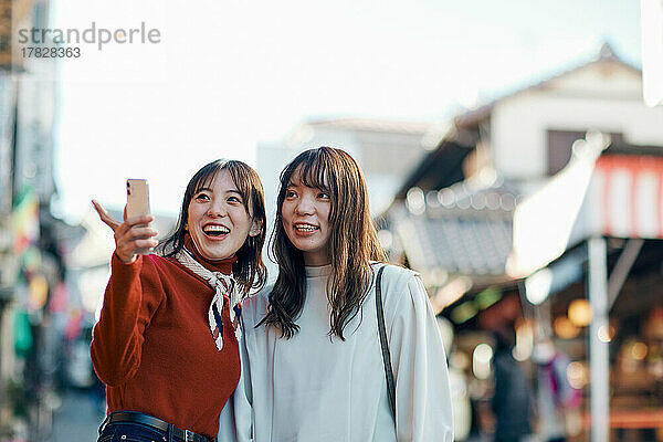 Young Japanese women enjoying a trip together