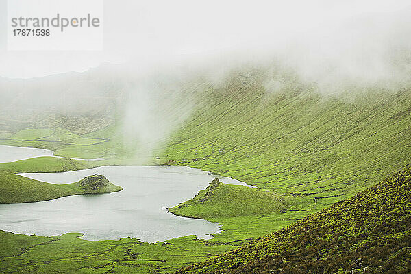 Scenic view of lake and mountains on fog Corvo  Azores  Portugal