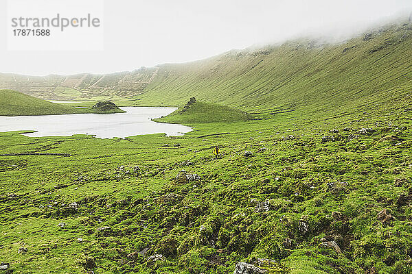 View of lake and green landscape on foggy day  Corvo  Azores  Portugal