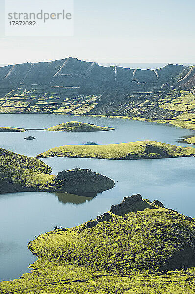 View of mountains and lake on sunny day at Corvo Island  Azores  Portugal