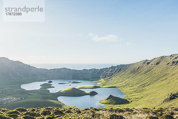 Idyllic view of lake amidst hills on sunny day at Corvo Island  Azores  Portugal