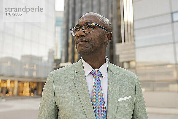 Businessman with eyeglasses at financial district