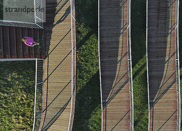 Russia  Aerial view of woman walking on boardwalk