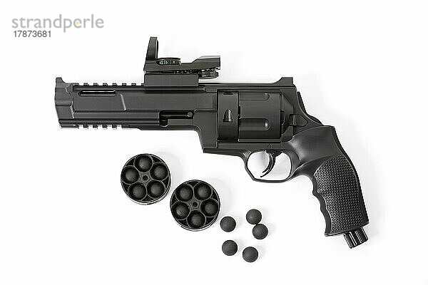 Co2 revolver with rubber bullets on white background