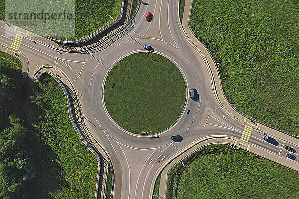 Cars at roundabout on sunny day