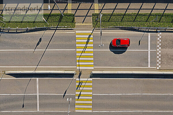 Russia  Aerial view of single car in front of empty zebra crossing