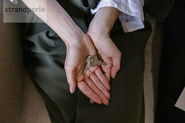Hands of businesswoman holding keys