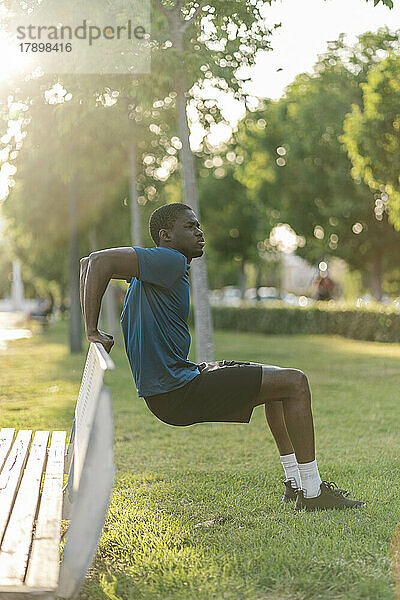 Man practicing exercise at bench