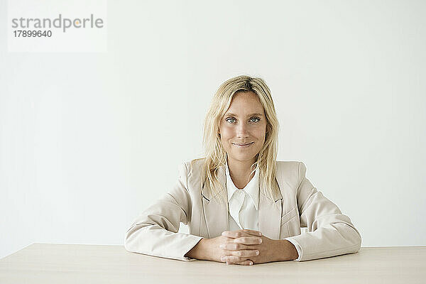 Portrait of a confident businesswoman at desk