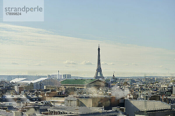 Elevated view of Paris cityscape with Eiffel Tower on sunny day  France