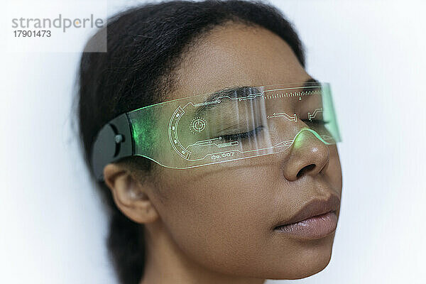 Woman relaxing with closed eyes wearing cyber glasses