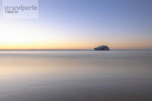 UK  Scotland  Long exposure of Firth of Forth at sunset with Bass Rock in background