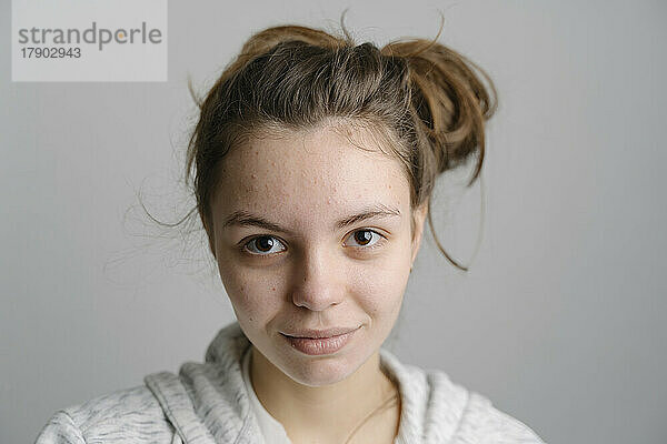 Young woman with messy bun