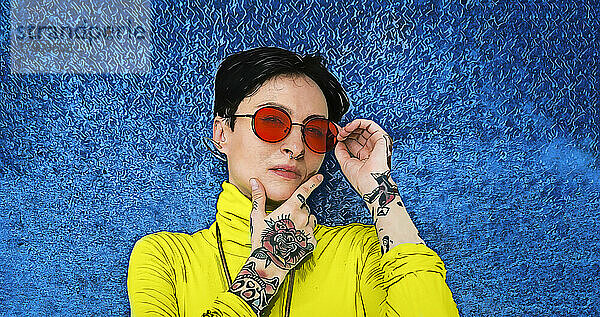 Tattooed hipster woman wearing sunglasses