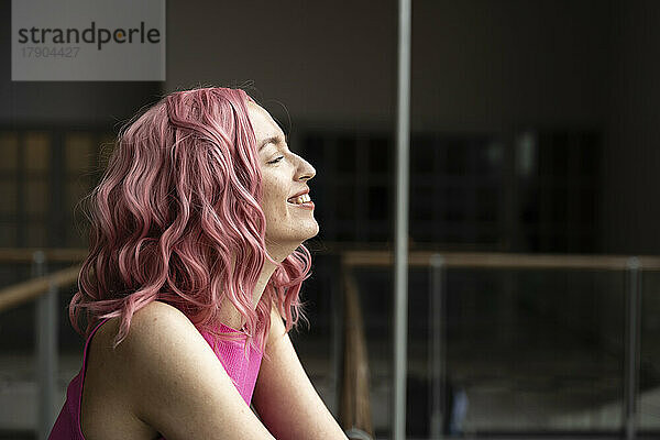 Happy woman with pink hair