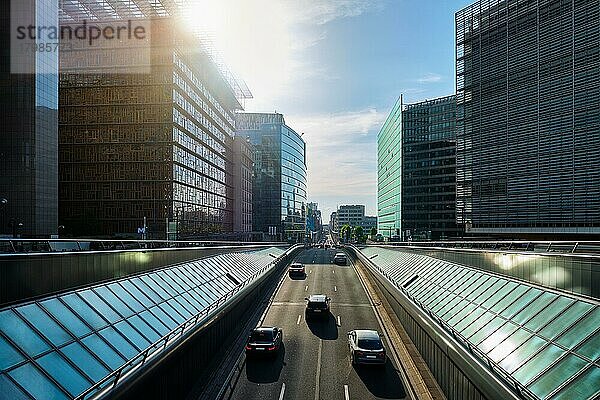 Street traffic in Brussels near European Commission building on sunset Rü de la Loi  Bruxelles  Belgium