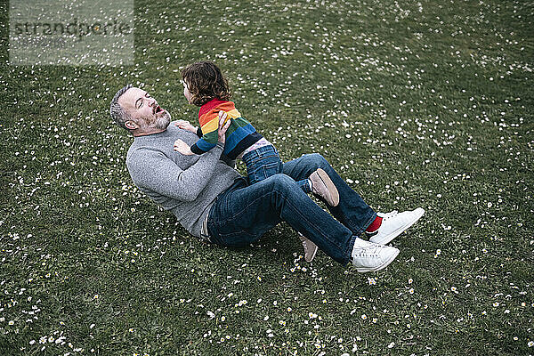 Father and daughter playing in park