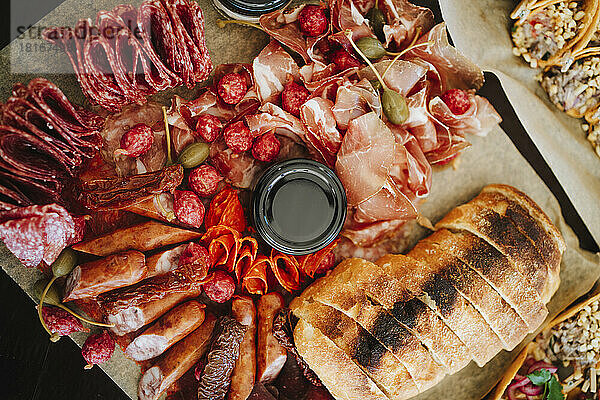 Platter of smoked sausages  salami and baguette