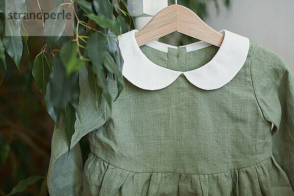 Green dress in hanger at store