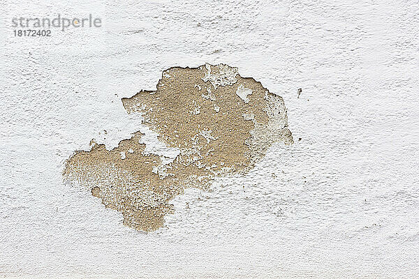 Close-up of paint peeling on exterior stone wall of house  Odenwald  Hesse  Germany