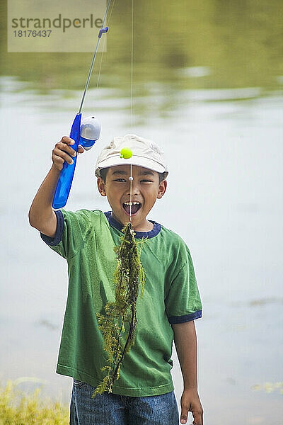 Boy with Fishing Line full of Pondweed  Lake Fairfax  Reston  Virginia  USA