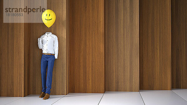 Dreidimensionale Darstellung einer unsichtbaren Person  die einen Ballon mit glücklichem Gesicht hält