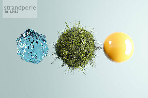 Dreidimensionale Darstellung von drei Kugeln  die Wasser  Gras und Sonne darstellen