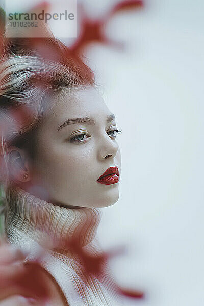 Contemplative girl with red lipstick