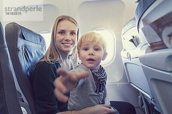 Mother with son in airplane