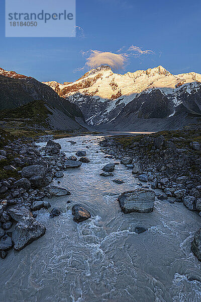 New Zealand  Canterbury Region  Hooker River at dawn with Mount Sefton in background