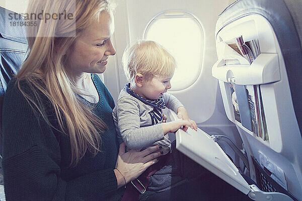 Mother with son in airplane