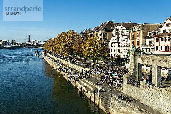 Switzerland  Basel-Stadt  Basel  People relaxing along riverside promenade in autumn
