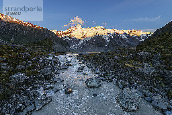 New Zealand  Canterbury Region  Hooker River at dawn with Mount Sefton in background