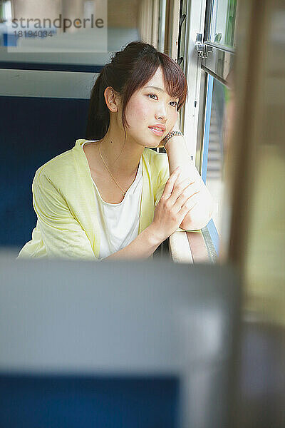 Japanese woman traveling by train