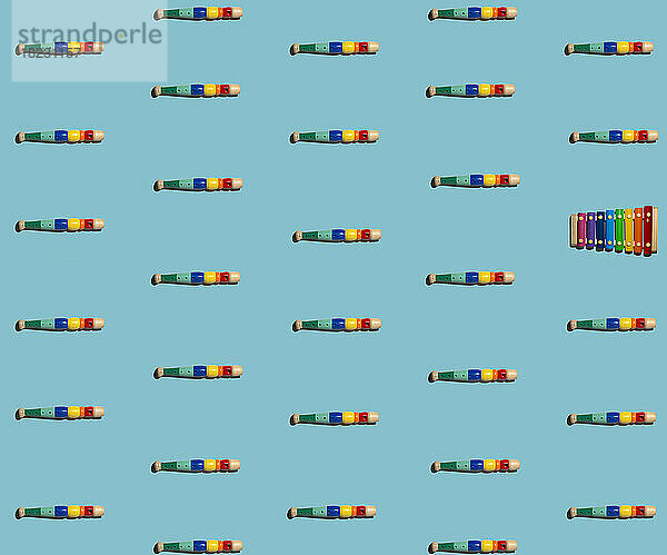 Pattern of colorful flutes with single xylophone
