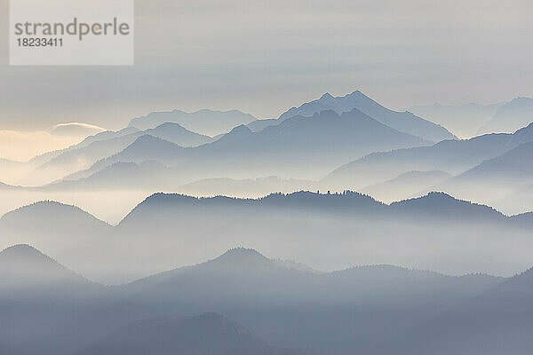 Germany  Bavaria  Jachenau  View from Herzogstand mountain at foggy dawn