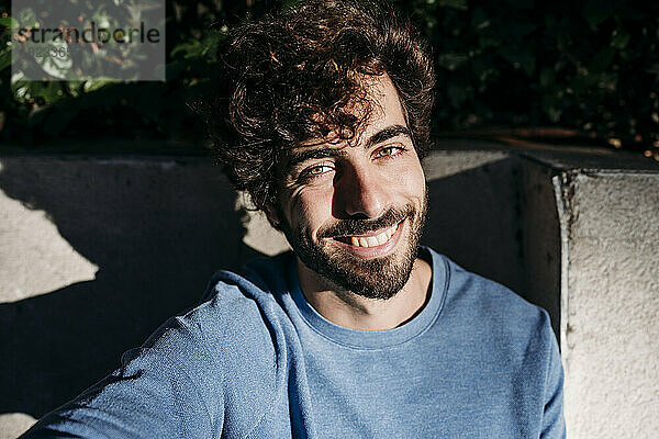 Happy man with sunlight on face