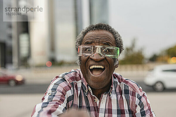 Excited man with mouth open wearing smart glasses