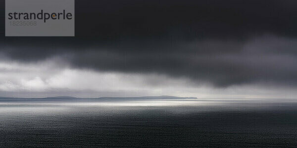 UK  Scotland  Panoramic view of dark dramatic clouds over Saint Magnus Bay