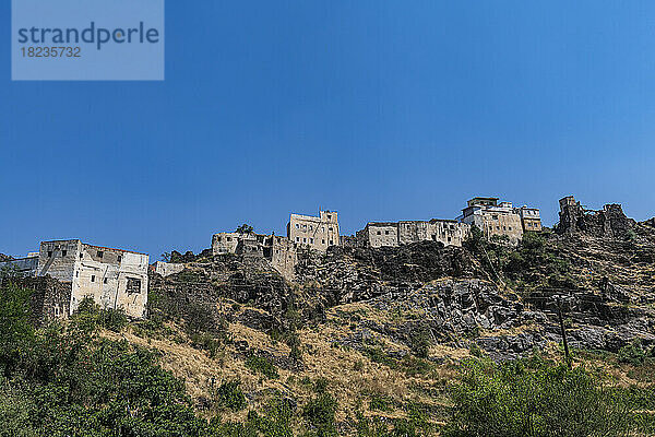 Old village on Asir mountain under blue sky