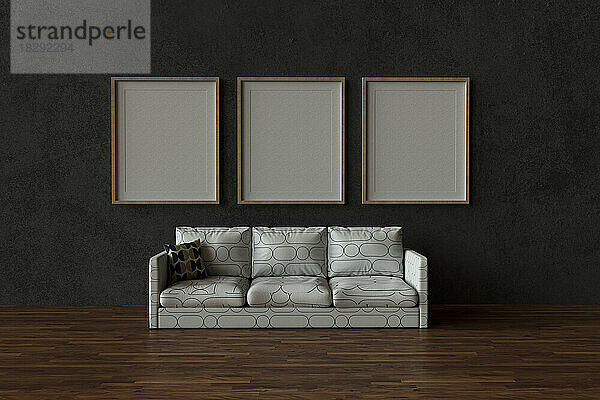 Dreidimensionale Darstellung eines weißen Sofas mit dahinter hängenden leeren Bilderrahmen