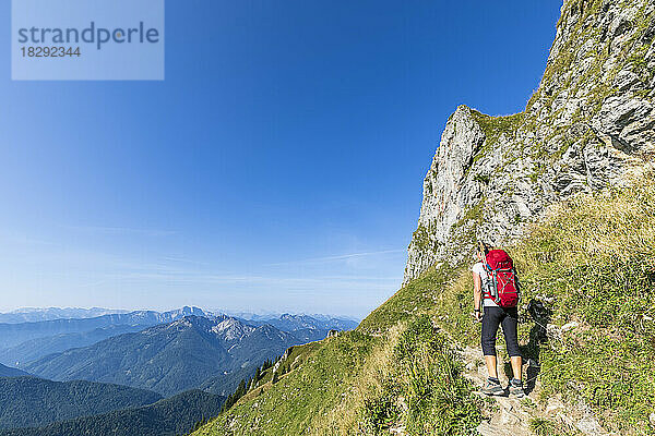 Germany  Bavaria  Female hiker on way to summit of Taubenstein mountain