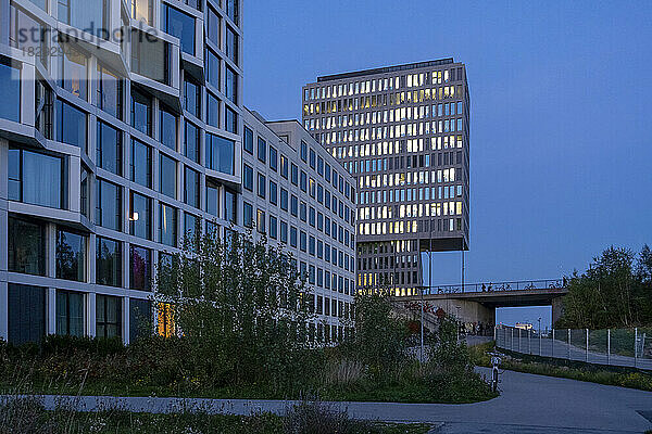 Germany  Bavaria  Munich  Modern office buildings at dusk