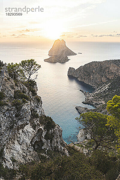 Spain  Balearic Islands  Cliffs of Ibiza island at sunset with Es Vedra in background