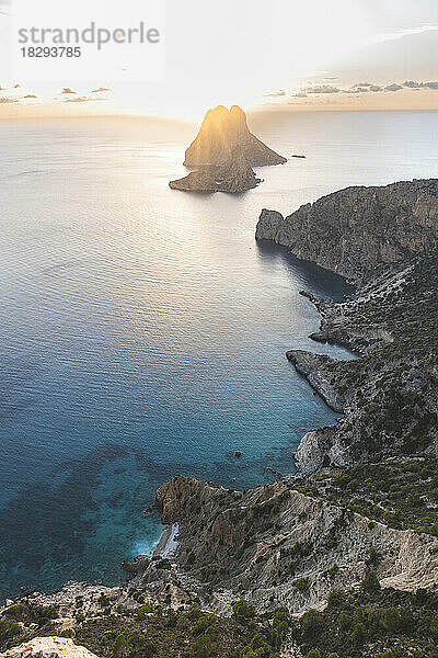 Spain  Balearic Islands  Cliffs of Ibiza island at sunset with Es Vedra in background