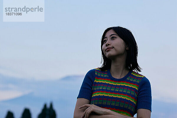 Young Japanese woman portrait at campsite