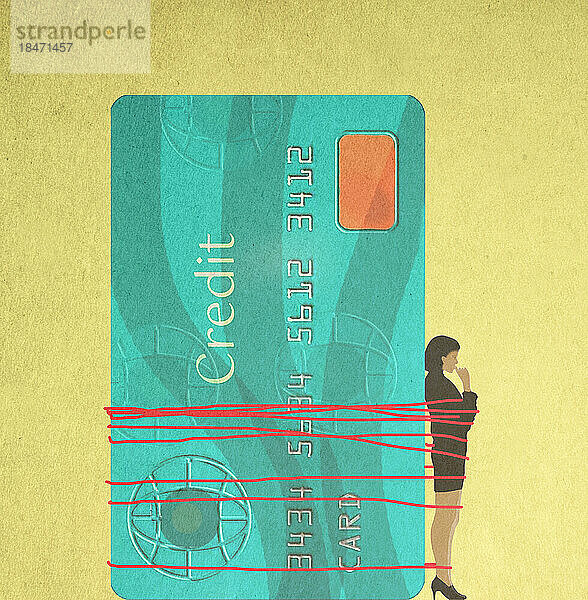Frau an übergroße Kreditkarte gefesselt