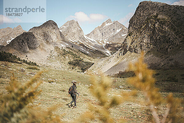 Woman hiking in Pyrenees on vacation  Selva de Oza  Huesca  Spain.