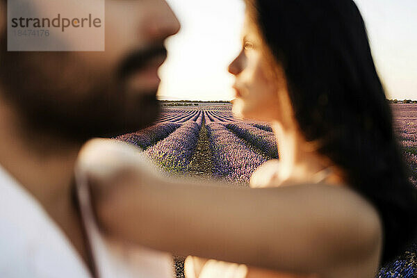 Young woman and man in lavender field