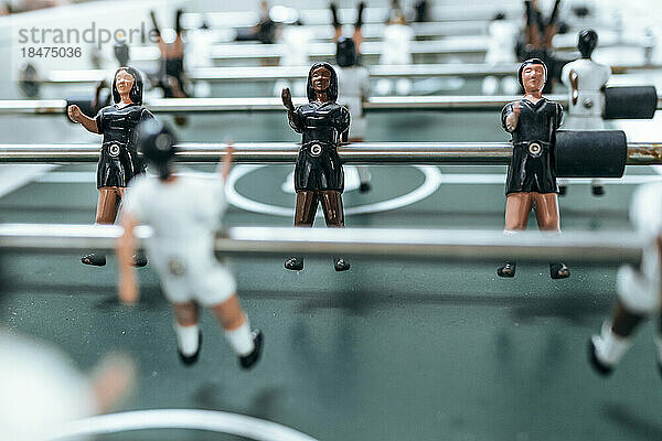 Foosball table with figurine at office